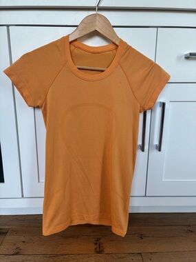 Lululemon Swiftly Tee size 4 in Orange